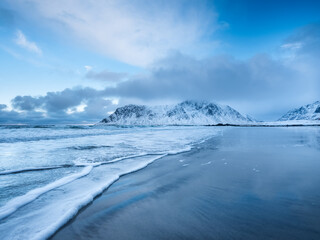Wall Mural - mountains, beach and wave. skagsanden beach, lofoten islands, norway. winter landscape near the ocea