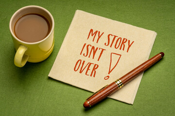 Wall Mural - My story is not over - positive affirmation note. Handwriting on a napkin with a cup of coffee, business, career and personal development concept.