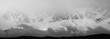 Mountains in the clouds, black and white panoramic view