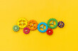 © 9dreamstudio - Top view of colorful gears. Corporate work and modern business process concept