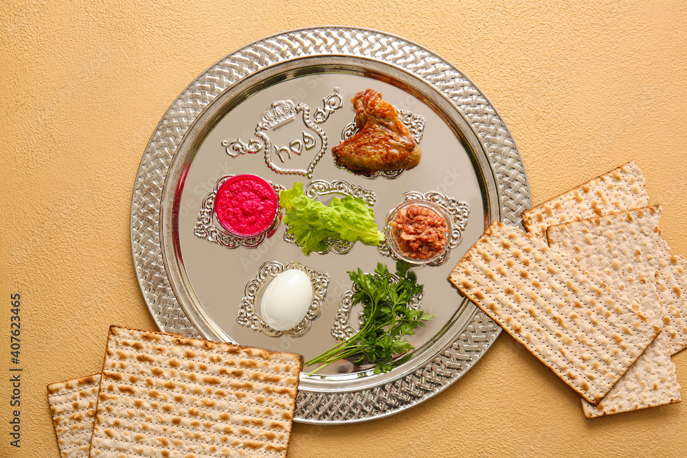 Passover Seder plate with traditional food on color background