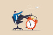 © Nuthawut - Productivity and efficiency in work, procrastination or time management or project deadline, best performance employee concept, smart relax businessman sitting on alarm clock launching paper airplane.
