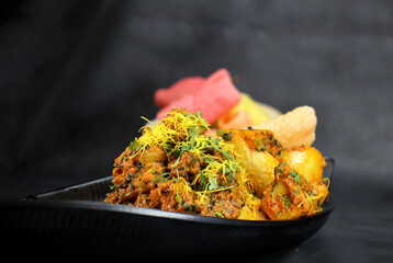 Wall Mural - Aloo sabzi is a Indian main course dish served with fryums,chapati or rice made with boiled potato and cumin.