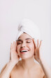 © Look! - Positive lady enjoys morning spa treatment. Girl after shower posing on isolated background