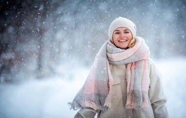 Wall Mural - Cheerful girl enjoying beautiful winter full of snow