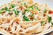 Plate of fresh and delicious fettuccine alfredo (fettuccine with butter)