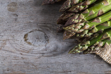 Wall Mural - green Asparagus. Bunches of green asparagus on a grey wooden rustic background