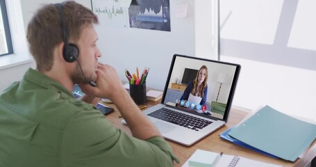 Poster - Caucasian man using laptop and phone headset on video call with female colleague