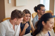 © luckybusiness - multiracial group of young people having fun at business seminar,  smiling