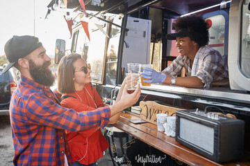 Wall Mural - couple socializing with employee in fast food service having a toast