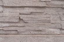 Porous Stone Background On Grey Bricks