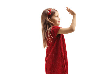 Girl in a red dress greeting with hand