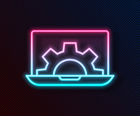 Glowing neon line Software, web development, programming concept icon isolated on black background. Programming language and program code on screen laptop. Vector.