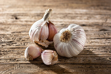 Garlic cloves on rustic wooden table