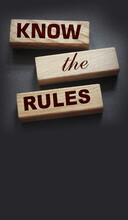 Know The Rules Word On Wooden Blocks Isolated On Dark Grey Background. Business Process Regulation Concept
