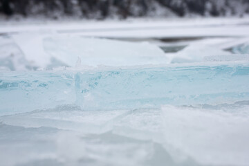 Ice floe blocks from drift ice driven ashore. Close-up. Natural background and texture.