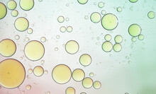 Abstract Background Of Light Yellow And Green Droplets