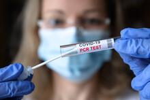 COVID-19 PCR Test In Doctor Hands, Nurse Holds Coronavirus Swab Collection Kit