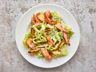 Canvas Print - portion of cesar salad with grilled prawns