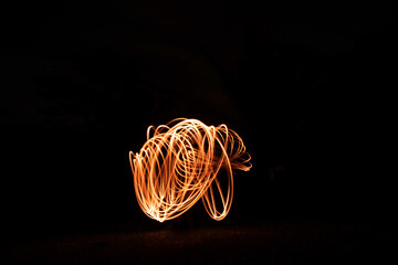 Wall Mural - Light painting with steel wool - Pyrotechnic display at night