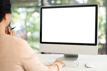 Wall Mural - women using computer working at home with blank white desktop screen.