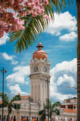 Sticker - Vertical shot of the Sultan Abdul Samad Building under a blue cloudy sky in Kuala Lumpur, Malaysia