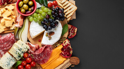 Wall Mural - Appetizers table. Cheese, fuits and meat board