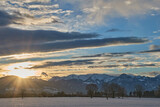 Fototapeta  - Sunrise over snowy mountain landscape