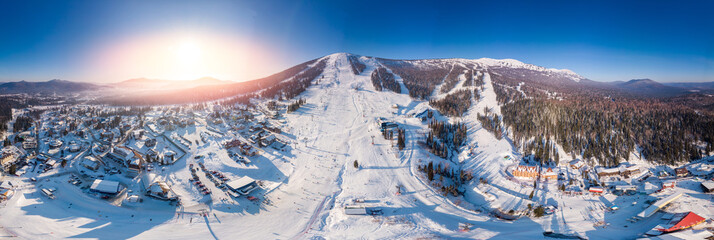 Panorama Sheregesh ski resort in winter, landscape on mountain and hotels, aerial top view Kemerovo region Russia