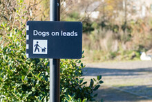 Dogs Must Be Kept On A Lead Or Leash In Public Park Play Area Sign