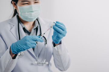 Wall Mural - female doctor, scientist, researcher is showing syringe and vaccine vial with medication, closeup. Vaccination and immunization