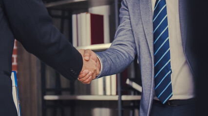 Businessman shaking hands partnership deal business in the office, happy confidence accepts handshaking employer getting hired at a new job.