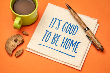 Wall Mural - It is good to be home - positive note. Handwriting on a napkin with a cup of coffee and cookie. Stay at home concept.