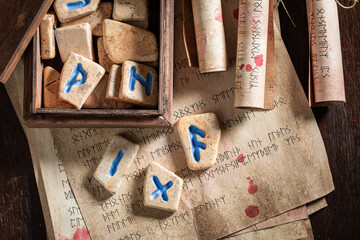 Vintage scrolls with Celtic language and runestones