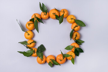 Ripe Fresh Tangerines With Leaves on Blue Background Tasty Citrus Top View Horizontal