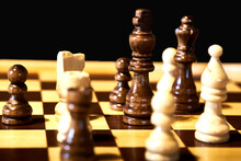Close-up View Of A Chess Game, With Selective Focus On The Black King.