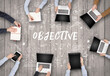 © ra2 studio - Group of business people working in office with OBJECTIVE inscription, coworking concept
