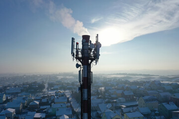 Telecommunication tower of 4G and 5G cellular. Base Station or Base Transceiver Station. Wireless Communication Antenna Transmitter. Telecommunication tower with antennas against blue sky.