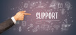 Close-Up of cropped hand pointing at SUPPORT inscription, modern business solution concept