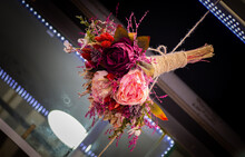 Closeup Shot Of Fake Flowers Bouquet Hanging From The Ceiling