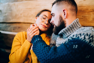 Wall Mural - Affectionate attractive young lovers during Christmas eve