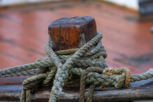 Mooring Rope Tied To A Wooden Pole On An Old Boat