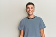 © Krakenimages.com - Young handsome african american man wearing casual clothes with a happy and cool smile on face. lucky person.