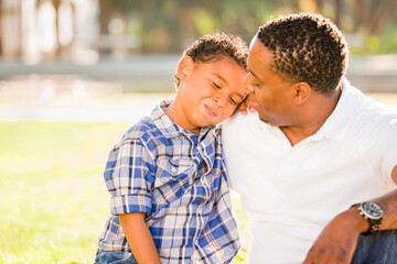 Happy African American Father and Mixed Race Son Playing At The Park