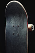 Close-up of old skateboard isolated on black background