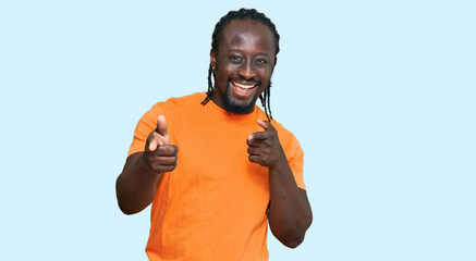 Poster - Handsome young african american man wearing casual clothes pointing fingers to camera with happy and funny face. good energy and vibes.