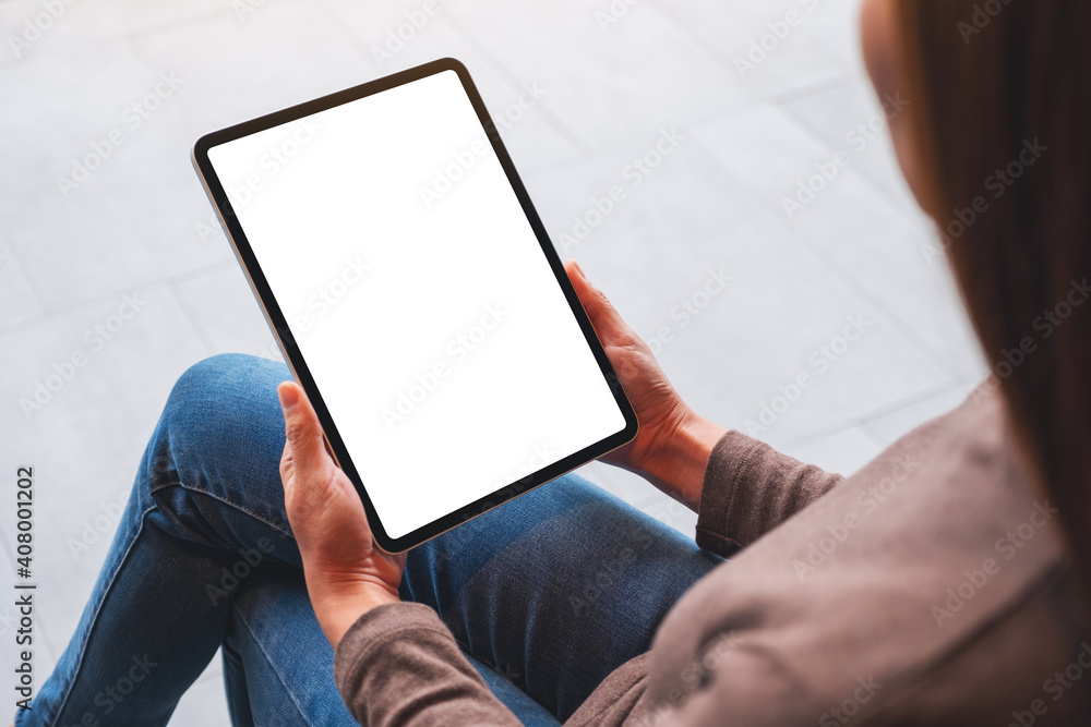 Mockup image of a woman holding digital tablet with blank white desktop screen - obrazy, fototapety, plakaty 