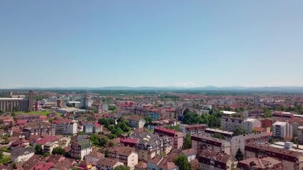 Wall Mural - An aerial view of the buildings, roads, and water at the Brcko district, Bosnia and Herzegovina in HD