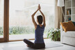 © kite_rin - Woman doing exercises at home, Girl training and practicing yoga indoors, Harmony, balance, meditation, relaxation, lockdown, social distancing, healthy lifestyle concept