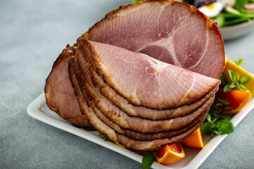 Wall Mural - Easter bone-in spiral ham on the table served for brunch